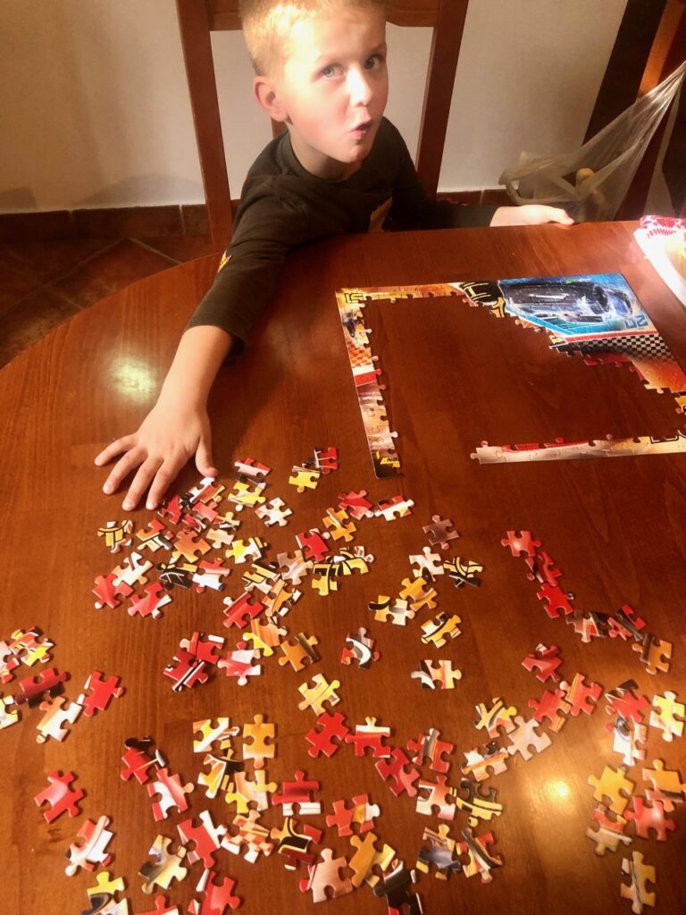 kid doing a puzzle